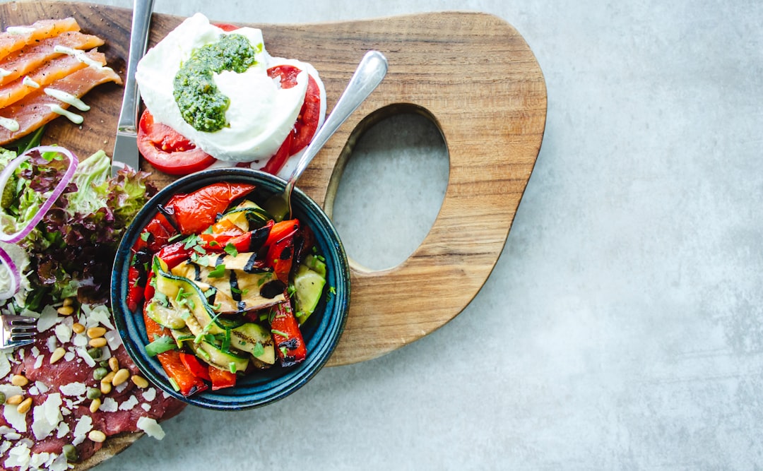 Photo by Louis Hansel tray of food on white surface